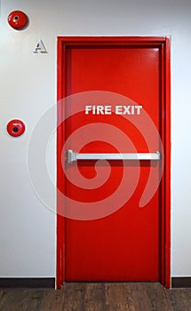 Fire exit emergency door red color metal material.