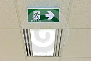 Fire exit sign on ceiling with light