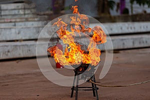 Fire explosion on the kitchenware, outdoors, prepared in a fire drill