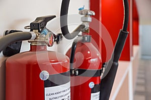 Fire extinguisher and gas pump system on the wall. Powerful emergency fire extinguisher equipment. Fire retardant. Fireproof.