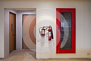 Fire extinguisher and gas pump system on the wall. Powerful emergency fire extinguisher equipment. Fire retardant. Fireproof.