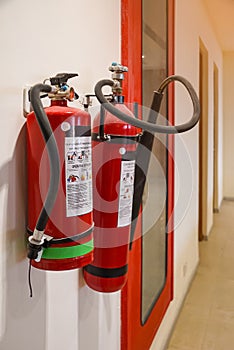 Fire extinguisher and gas pump system on the wall. Powerful emergency fire extinguisher equipment. Fire retardant. Fireproof.