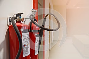 Fire extinguisher and gas pump system on the wall. Powerful emergency fire extinguisher equipment. Fire retardant. Fireproof.