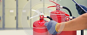 Fire extinguisher has engineer inspection checking pressure gauges of fire extinguishers