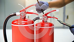 Fire extinguisher has fire safety engineering services checking in the back to prepare fire equipment for protection and prevent