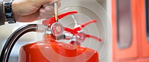 Fire extinguisher has hand engineer inspection checking pressure gauges to prepare fire equipment for protection