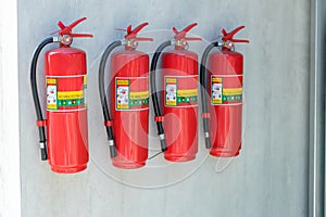 Fire extinguisher in the operating department . Install a fire extinguisher on the wall in building. Dry chemical powder fire exti