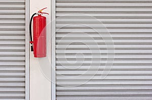 Fire extinguisher on the shutter door