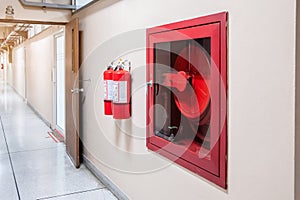 Fire extinguisher system on the wall background, powerful emergency equipment for industrial