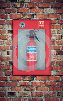 Fire extinguisher in wall box. brick wall