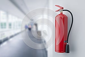 Fire extinguishers hanging on wall in office