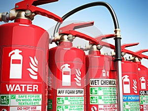 Fire extinguishers isolated on blue background Various types of