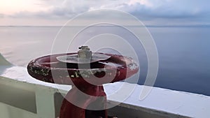 Fire faucet on the ship's rail on a sunny day