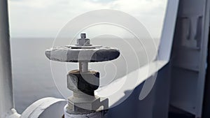 Fire faucet on the ship's rail at sunrise