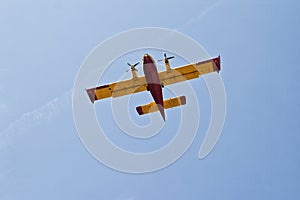 Fire fighter airplane in the sky over the Mediterranean Sea