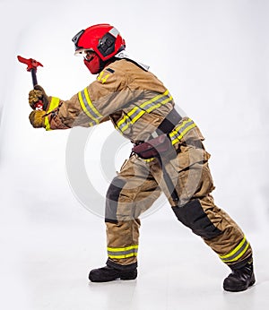 Fire fighter with ax on white