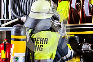 Fire fighter with breathing protection and oxygen tank
