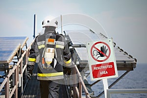 Fire fighter on oil and gas industry, successful firefighter at work , Fire suit for fighter with fire and suit for protect fire