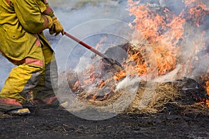 Fire fighter putting out fire.