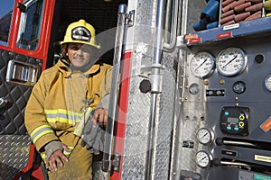 Fire Fighter Sitting At Fire Brigade's Door photo