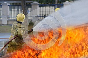 Fire fighter Using water mist fire extinguishers to combat oil flames to control fire from spreading firefighters and industrial