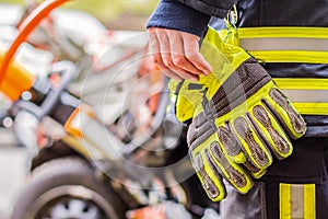 Fire fighter works with professional tools on a crashed car