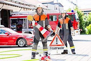Fire fighters setting up attention sign photo