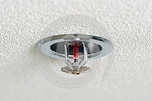 Fire fighting equipment, sprinkler on white ceiling