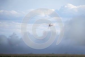 A Fire Fighting Helicopter Amongst The Smoke Cloud Of A Wildfire