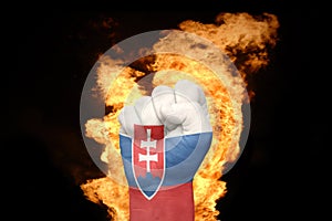 Fire fist with the national flag of slovakia