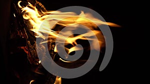 Fire flame isolated black isolated background Beautiful orange. Flame border . Sparks from campfire