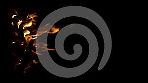 Fire flame isolated black isolated background Beautiful orange. Flame border . Sparks from campfire