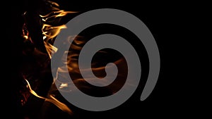 Fire flame isolated black isolated background Beautiful orange. Flame border . Sparks from campfire