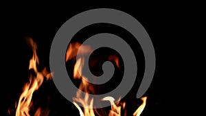 Fire flames on a black background. Abstract fiery texture. Realistic fire flames burn movement frame. Texture of fire for Design.