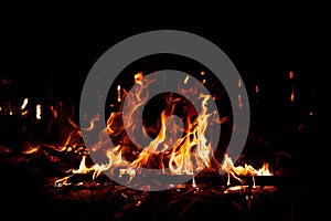 Fire flames on black background. Burning texture.
