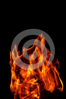 Fire flames isolated on a black backdrop. Abstract fire background