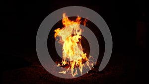 Fire flames lit burns. A real flame lit up against a black background. Real fire. Transparent background fire visual