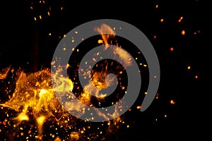 Fire flames with sparks on a black background