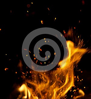 Fire flames with sparks on a black background