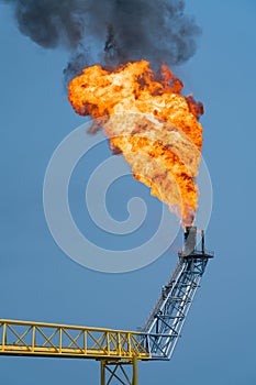 Fire on flare stack at offshore oil and gas central processing platform while burning toxic and release over pressure.