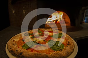 Pizza on wood burning fire oven