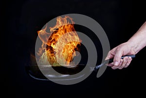 Fire on frying pan photo