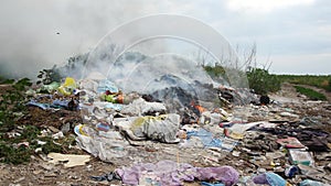 Fire at the garbage dump. Burning garbage, ecology in danger