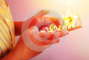 Fire hand hold fire smartphone .