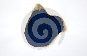 A fire hole in the white paper