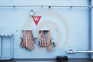 Fire hose hanging on the wall in battle ship