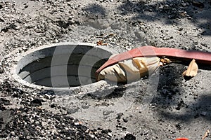 Fire hose in open manhole