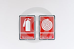 Fire hose reel sign on white wall.Thailand.