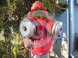 fire hydrant. Outdoor equipment for extinguishing fires in urban environments. Metal painted in kars color. Two fire