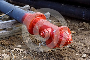 The fire hydrant is prepared for installation on the construction site